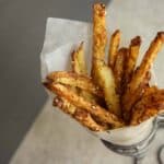 Spicy pomme frites also called baked spicy french fries with sesame seeds