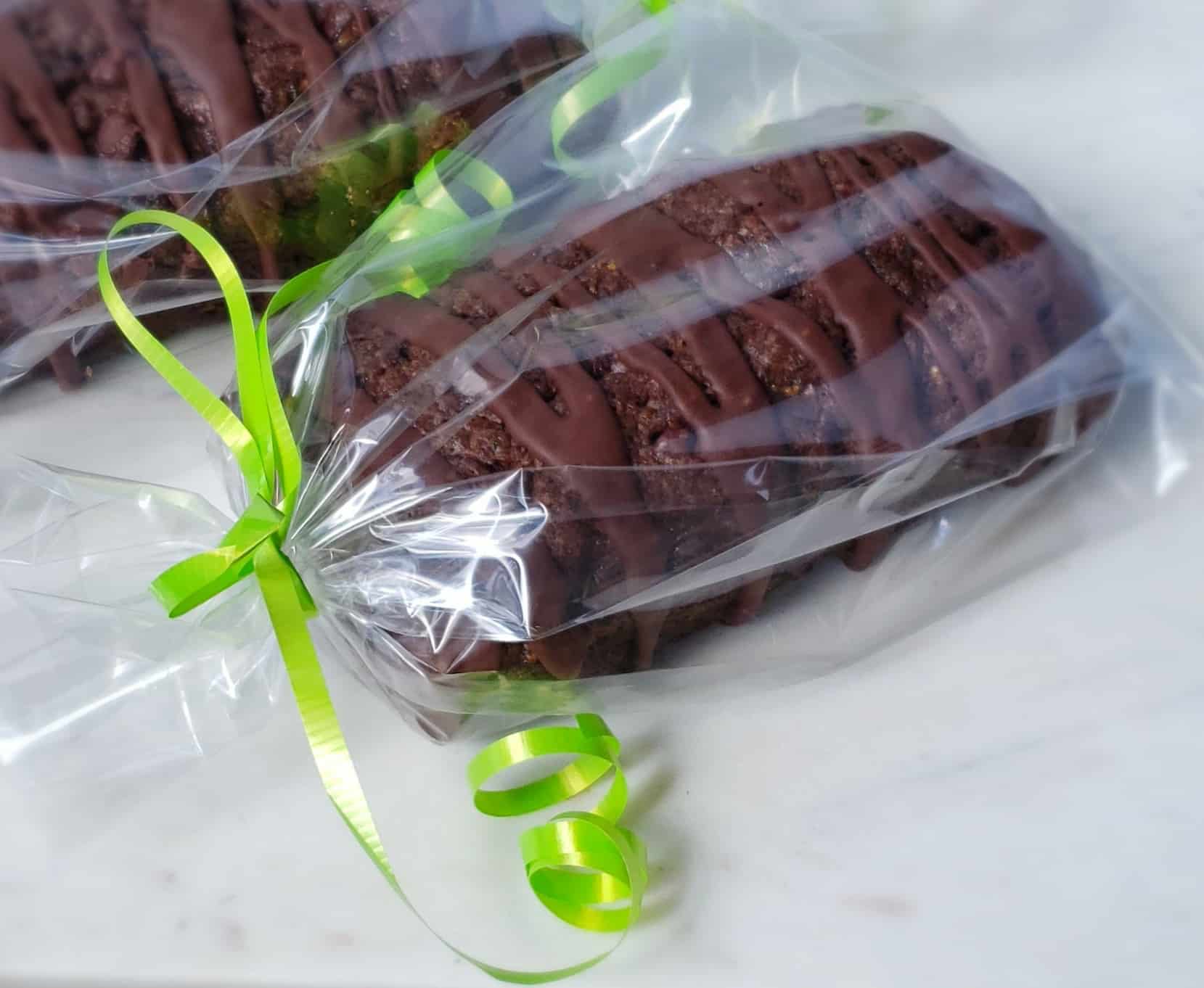 Glazed Nutella Chocolate Zucchini Bread is so rich and moist it could also be called cake! So easy. No mixer needed. Perfect for gift giving. Wrapped in a clear gift bag with lime green ribbon