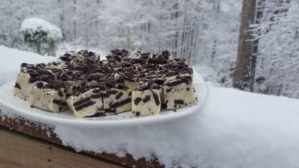 Cookies n Cream White Chocolate Fudge. I made it the day it snowed here in Alabama. I put the tray of white fudge on a white plate and the contrast of the Oreo cookies is so cool.