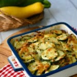 Zucchini Squash Casserole with Yellow squash in square dish.