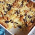 Honey Bread PUdding with raisins in a whi