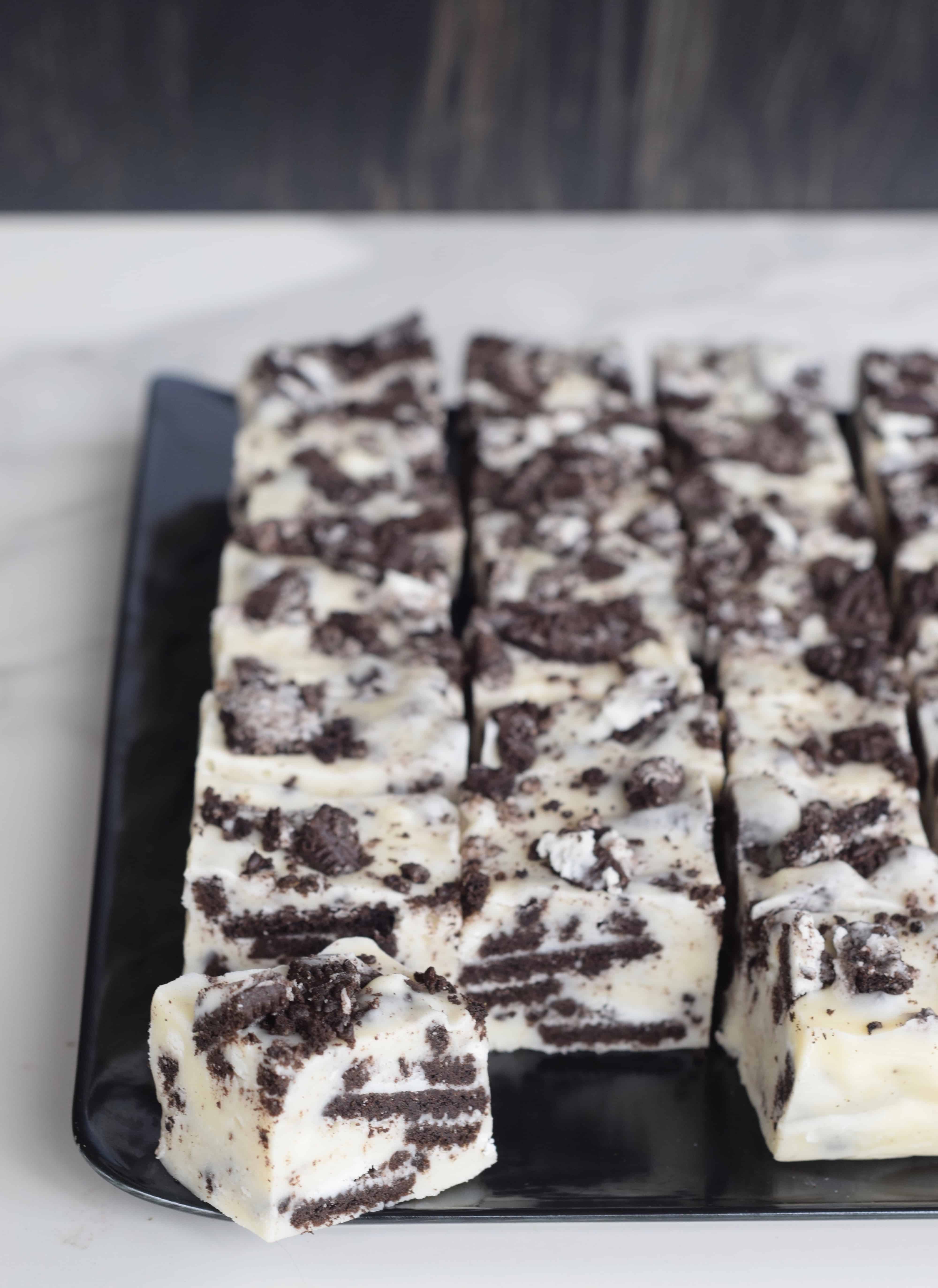 Cookies n Cream White Chocolate fudge on a black platter is so rich it goes a long way for gift giving