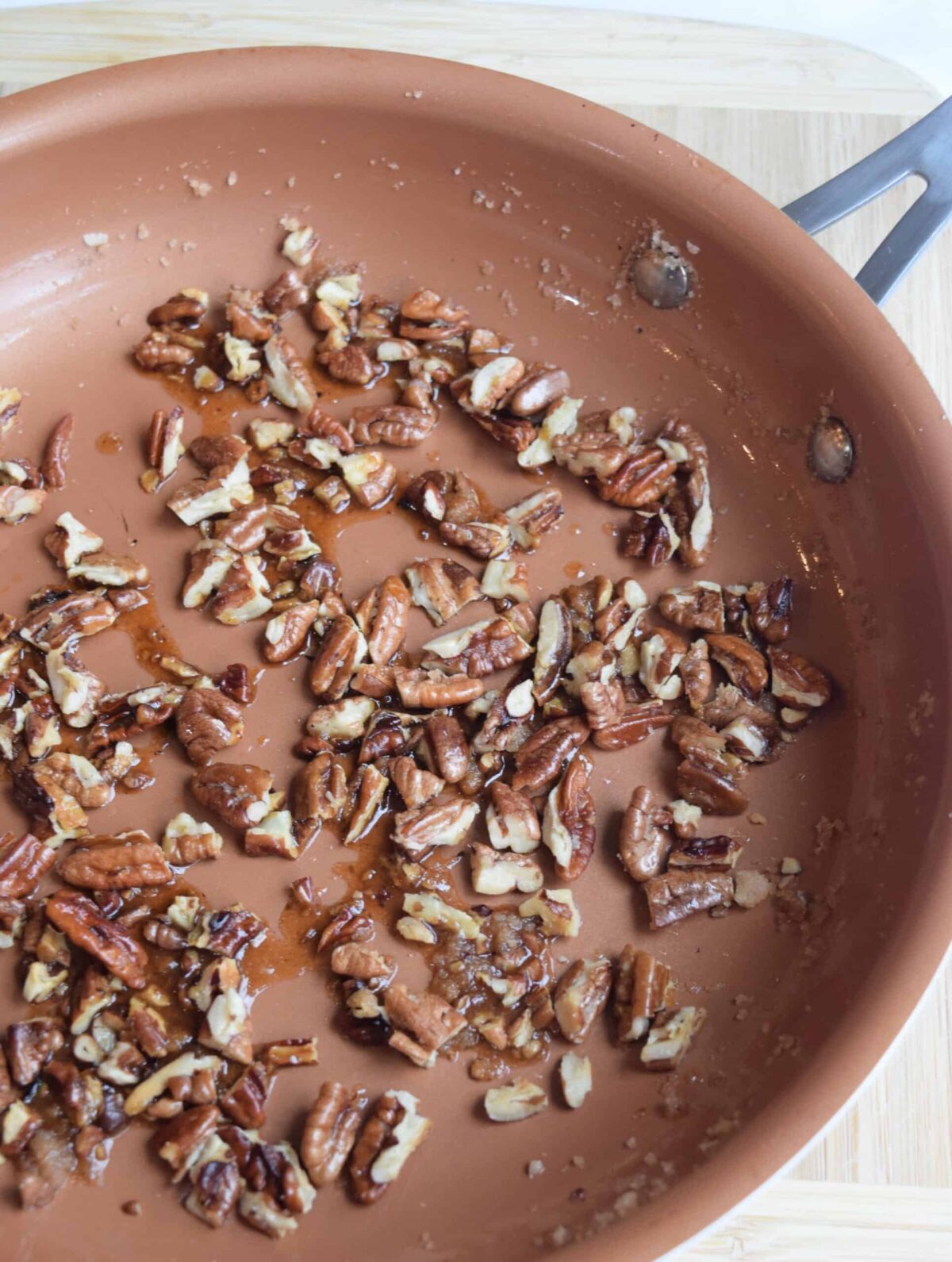 candied pecans in a copper skillet