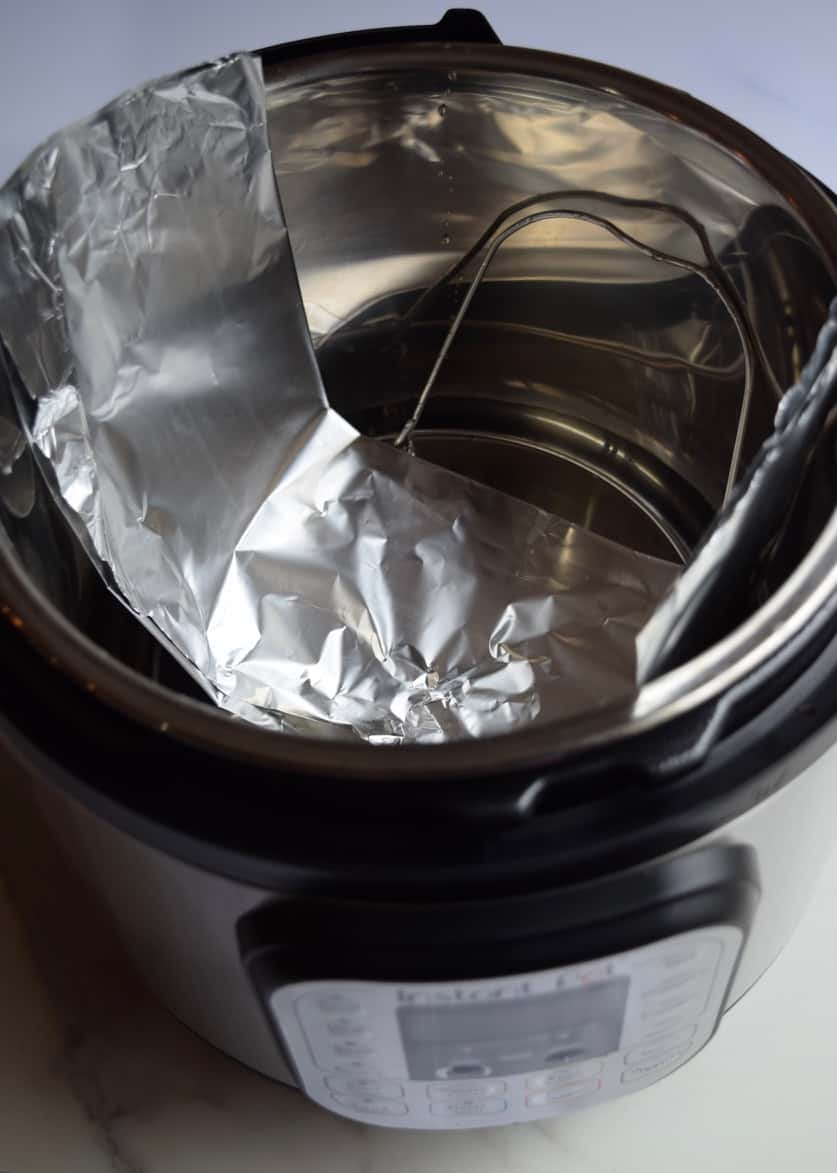 Strip of aluminum foil being used as a sling in an Instant Pot