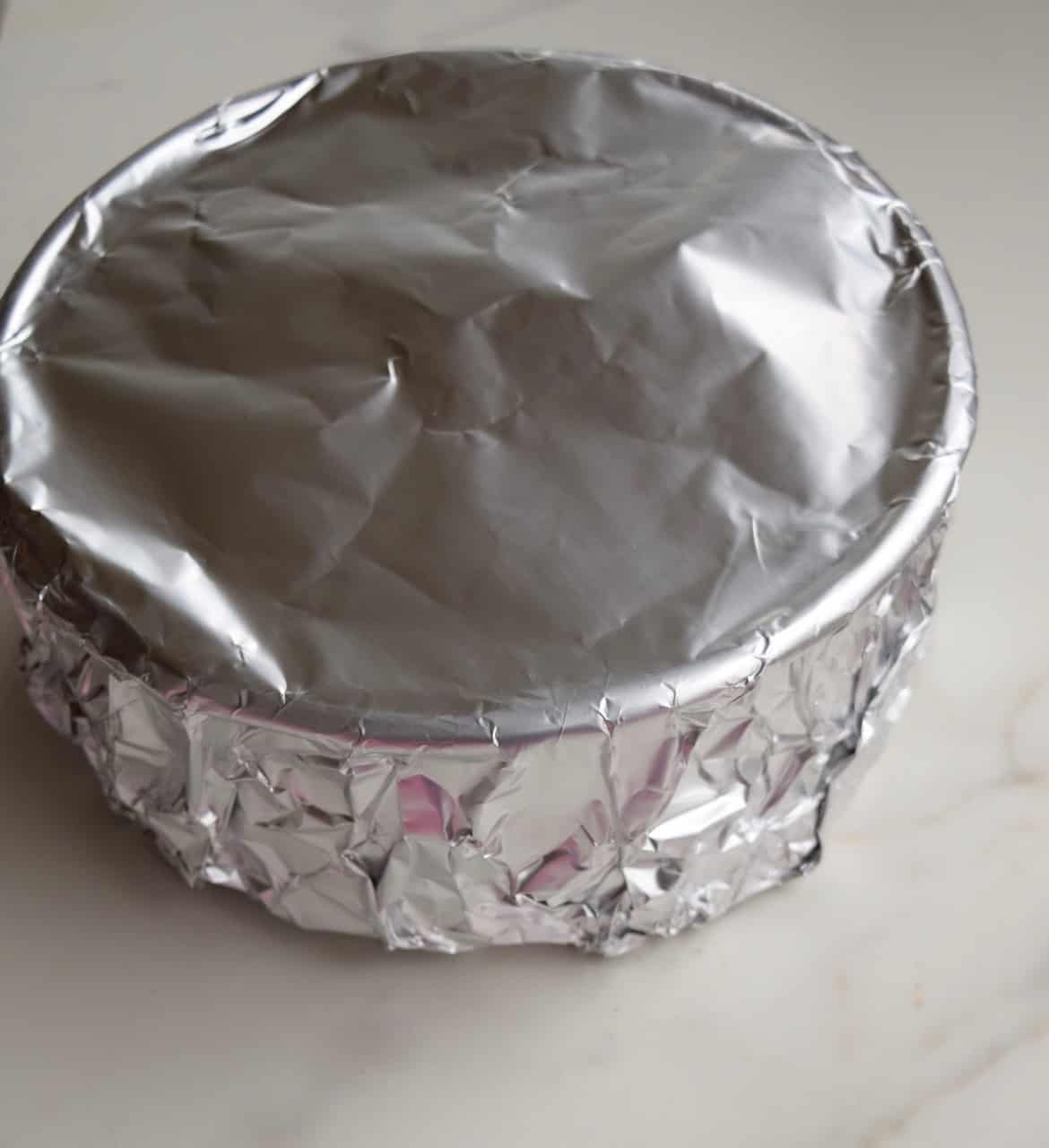 Aluminum foil covering a cake pan