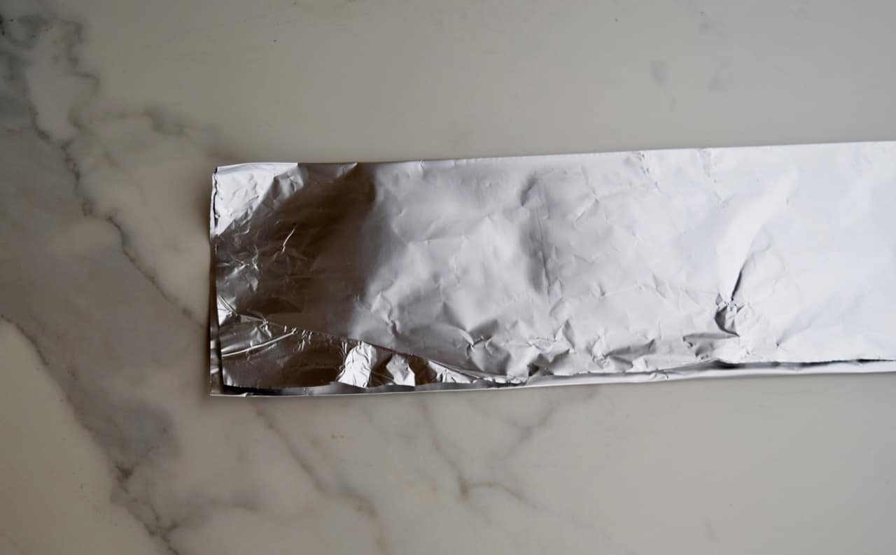 strip of aluminum foil folded in half