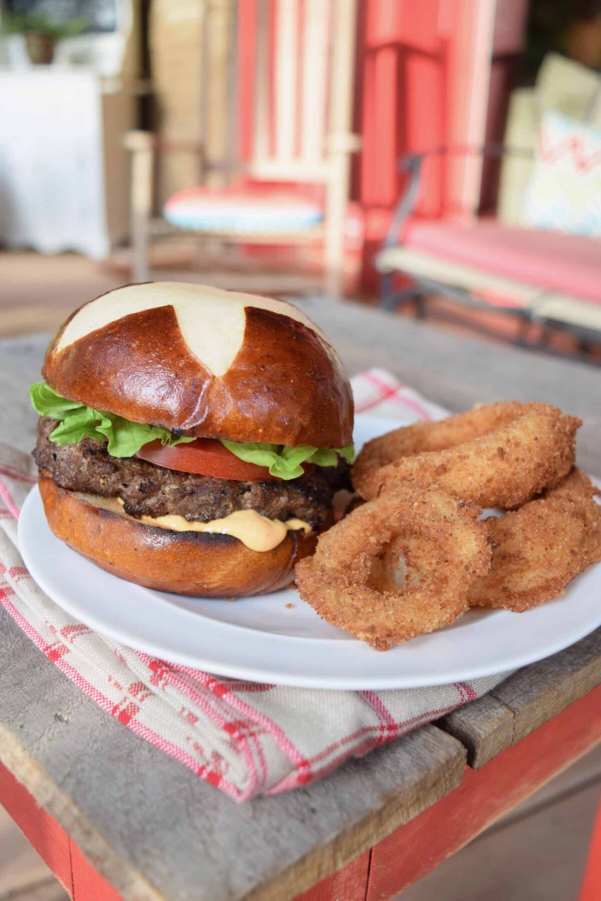 vidalia onion rings venison burger on table