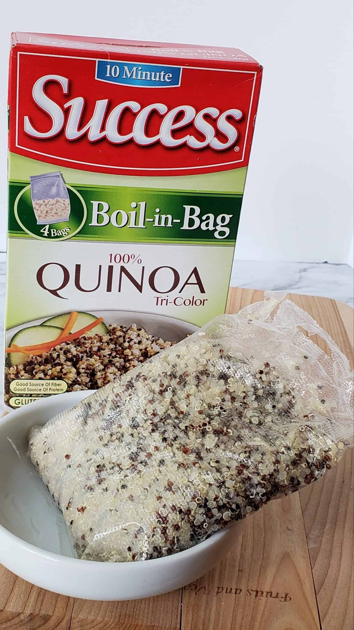 tri color quinoa boil in bag package with cooked package in a bowl