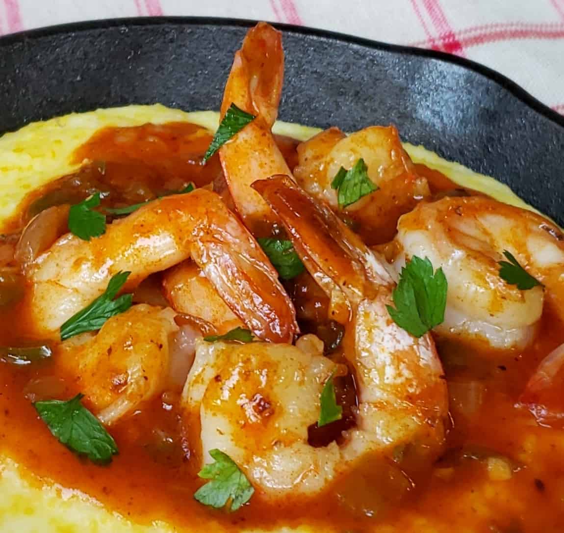 Close up view of Shortcut Shrimp and Grits in a cast iron skillet