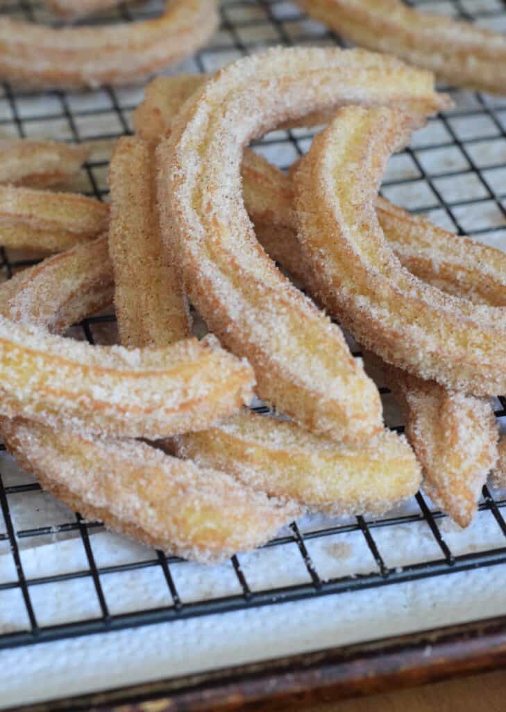 Churros with Vanilla Dipping Sauce. They are crisp on the outside, soft and tender on the inside. On a wire rack over paper towels.