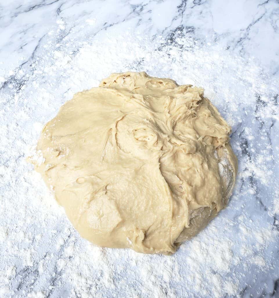 Cinnamon Roll dough on floured marble surface