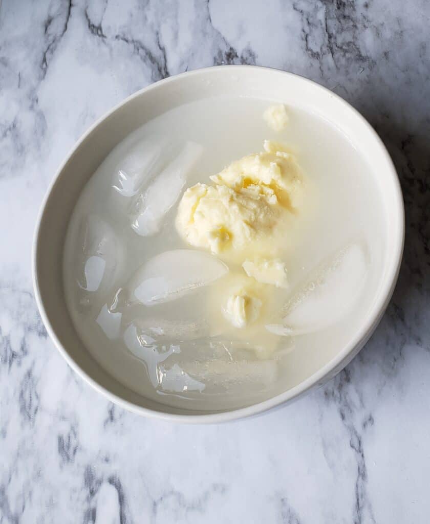 Homemade butter in ice water to firm up and wash away milk