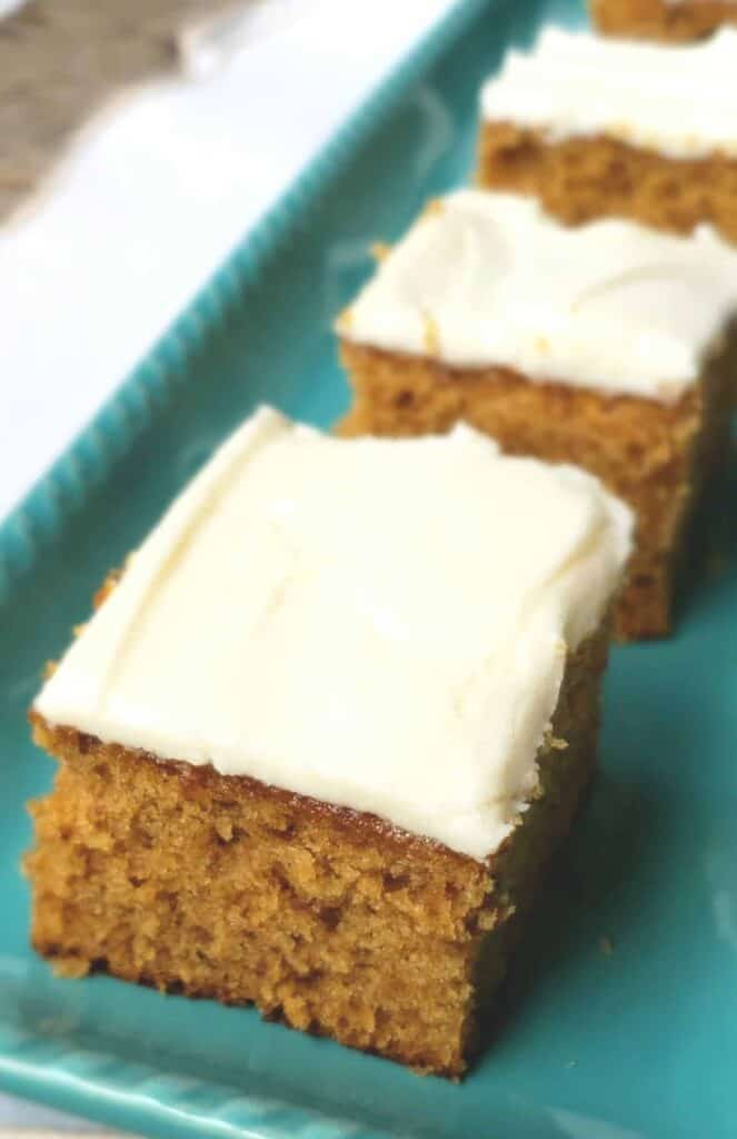 Fig Jam Cake frosted with Maple Buttercream on a turquoise platter