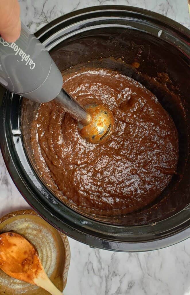 Immersion Blender in slow cooker crock of fig jam