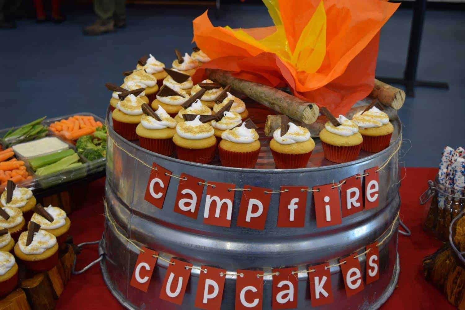 smores cupcakes on a metal tub with words Campfire Cupcakes strung across