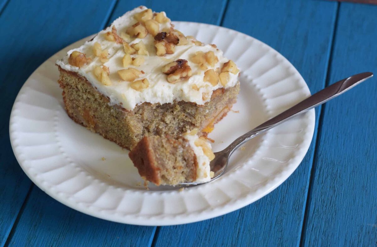 Persimmon Spice Sheet Cake slice with bite taken out with fork