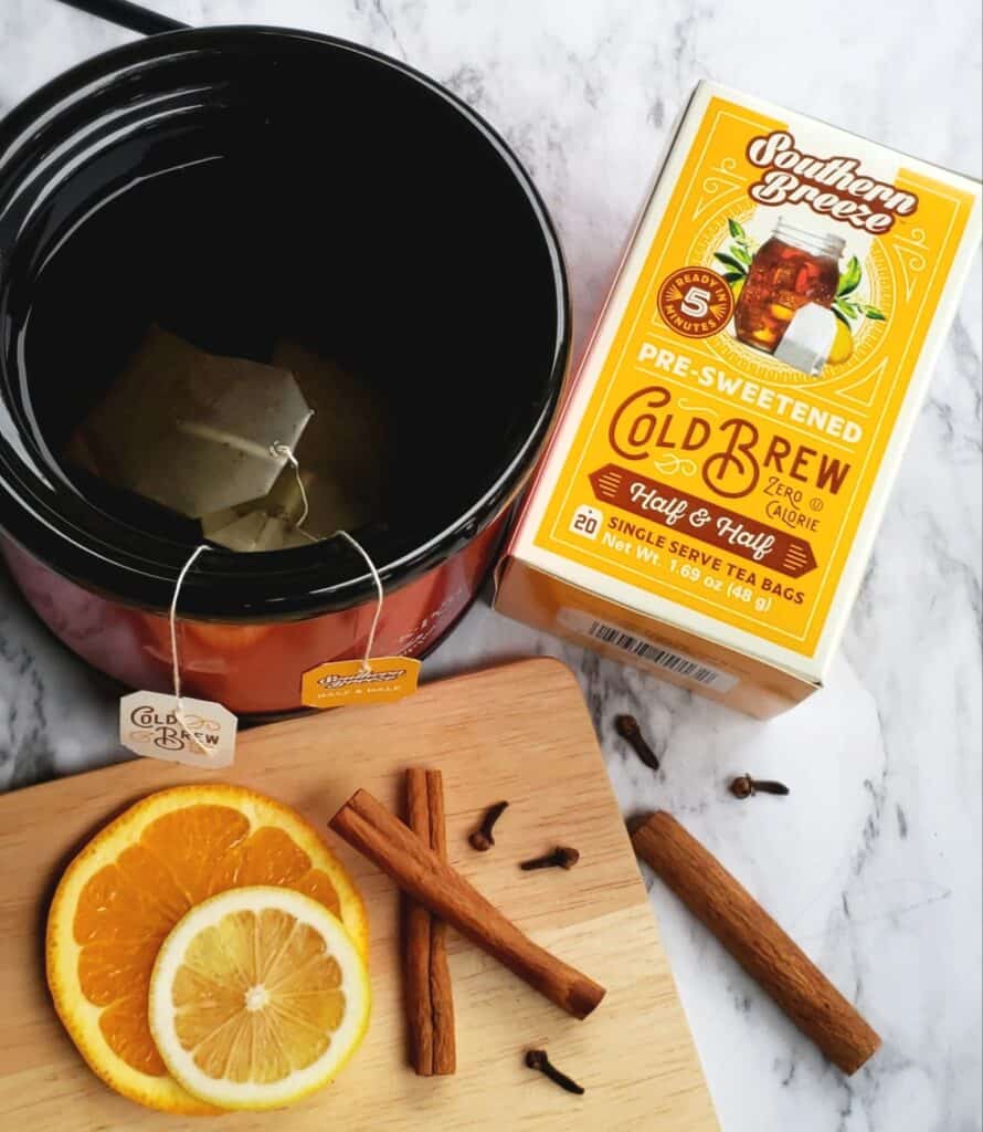 Steeping Southern Breeze Sweet Tea bags in slow cooker with mulling spices