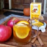 clear mug of hot tea with orange slice