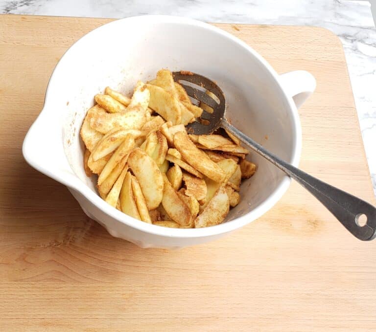 apple galette apple mixture in white bowl