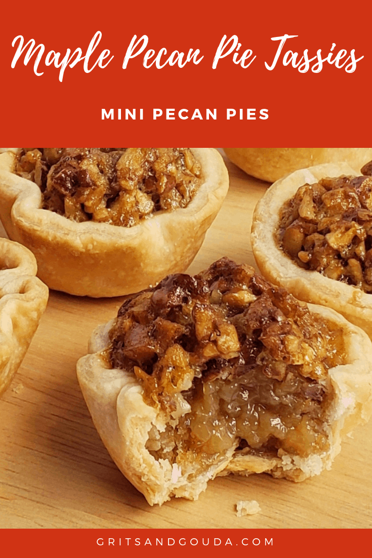 Mini pecan pie with bite taken out on wooden surface and additional tassies around it