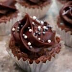 You can make these year 'round and in many sizes to match the occasion and your appetite! This little bite is a double chocolate brownie topped with a luxurious dollop of chocolate frosting and sprinkled with silver and white round sprinkles. You won't believe the shortcut in this recipe!
