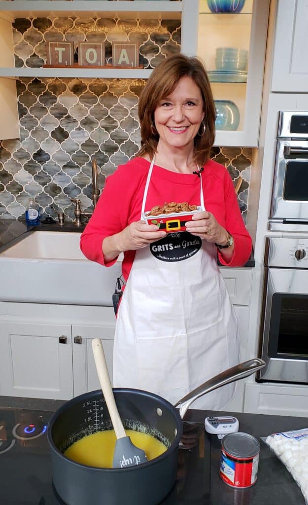 3 Ingredient Cinnamon Sugar Toasted Pecans made on Talk of Alabama morning show, Kathleen Phillips is holding a santa bowl of them.