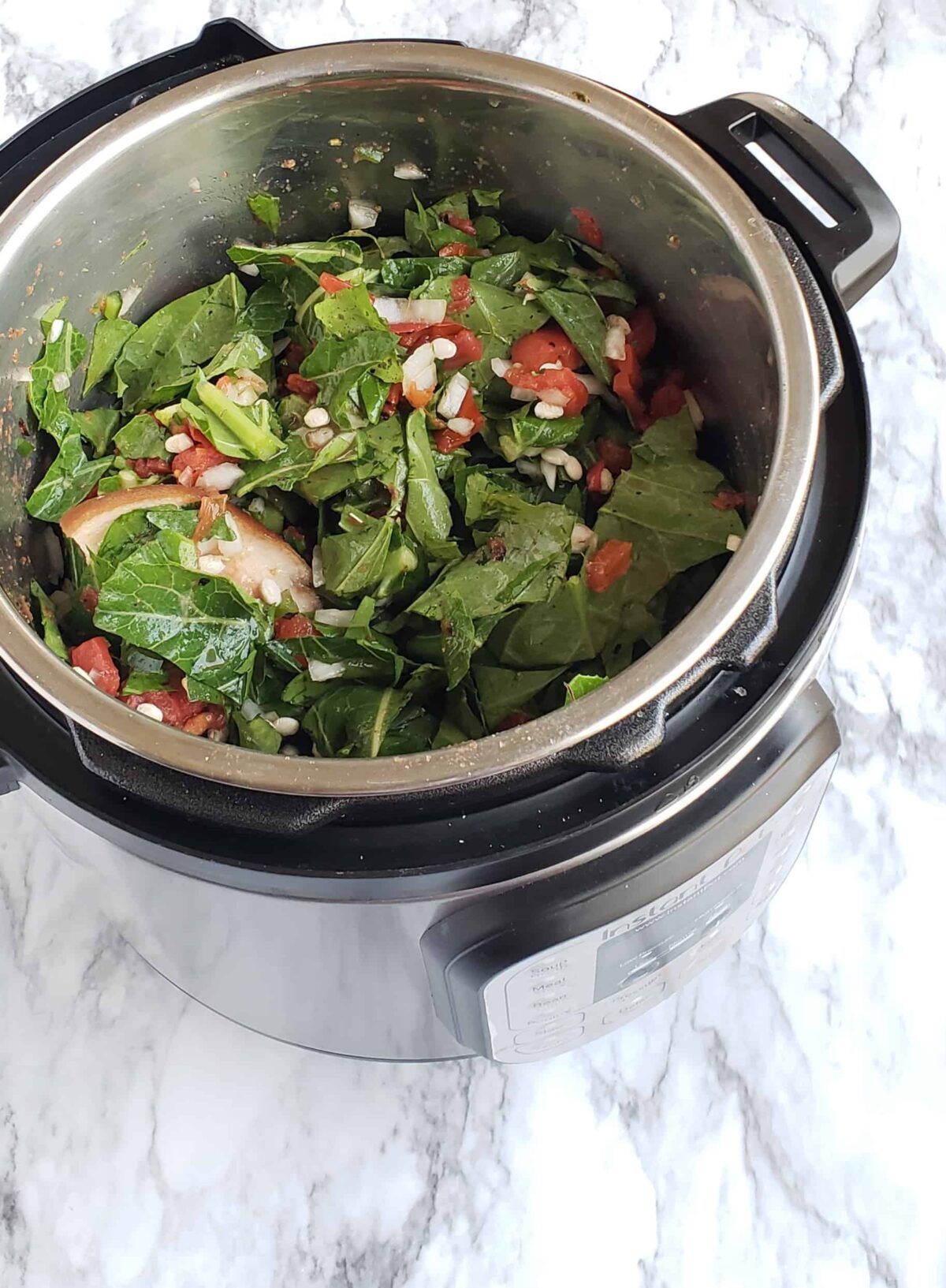 Tossed ingredients of Collard Greens and Navy Beans in the Instant 