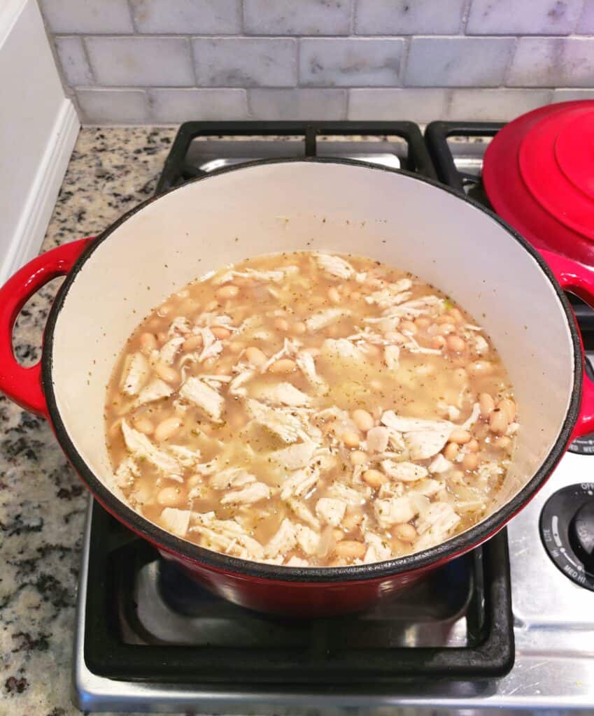 Simmering White Bean Chicken Chili. If you prefer a creamier, less brothy soup, partially mash the beans with a potato masher right in the soup pot.