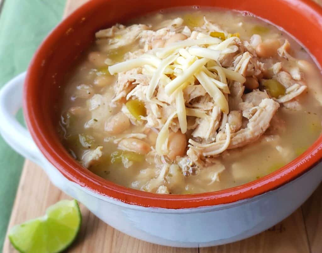 Shortcut White Bean Chicken Chili with Monterey Jack Cheese and lime are just two of my favorite toppings. Add sour cream, cilantro, and salsa if you like.