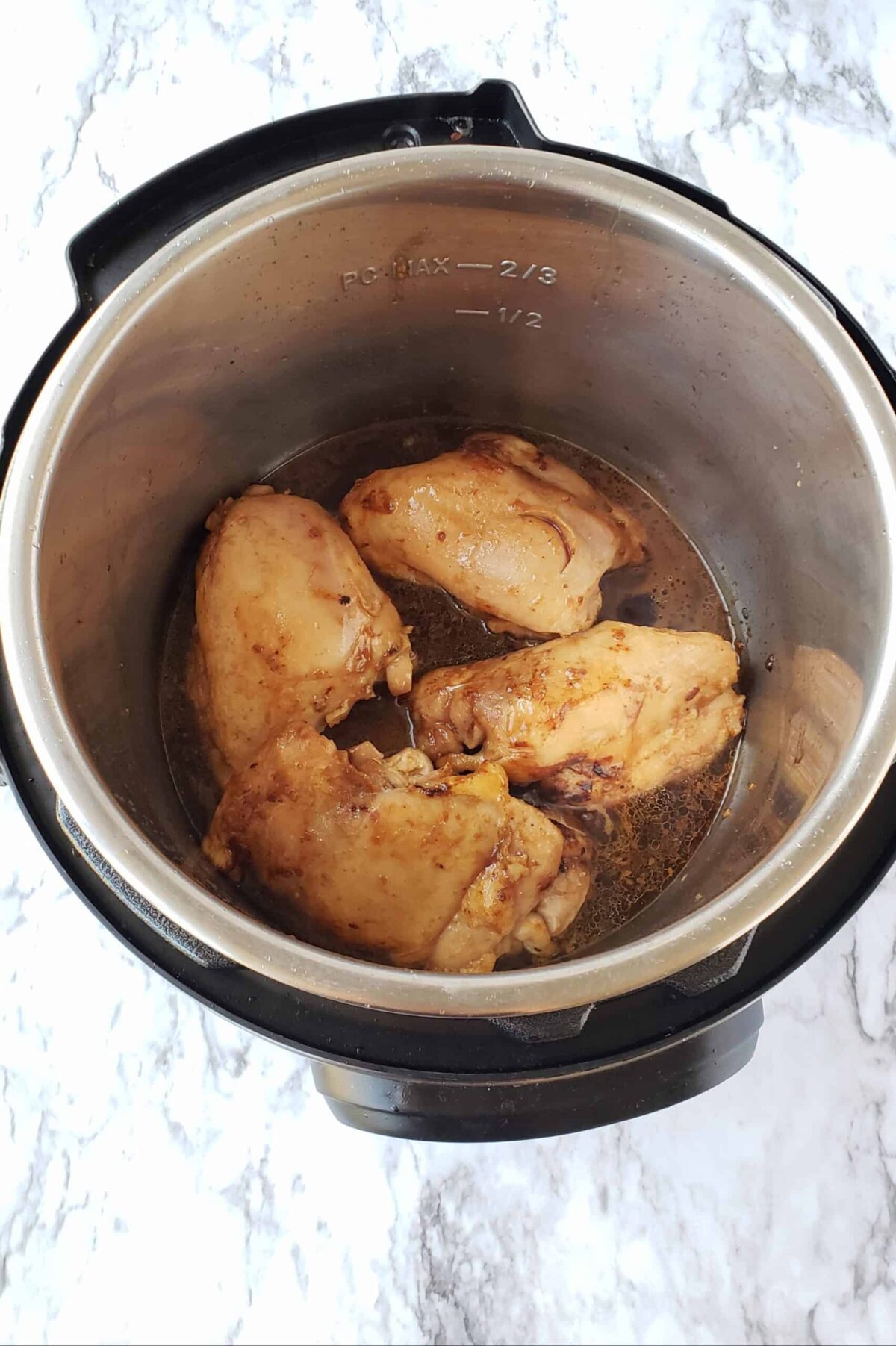 Add the 1/2 cup marinade to the Instant Pot and add the chicken thighs back to the pot.