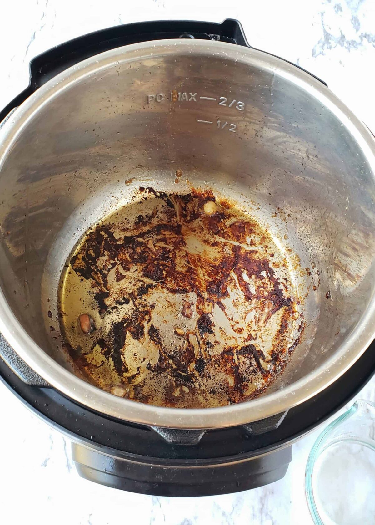 Your Instant Pot pan will look like this after browning the chicken thighs in the pan.