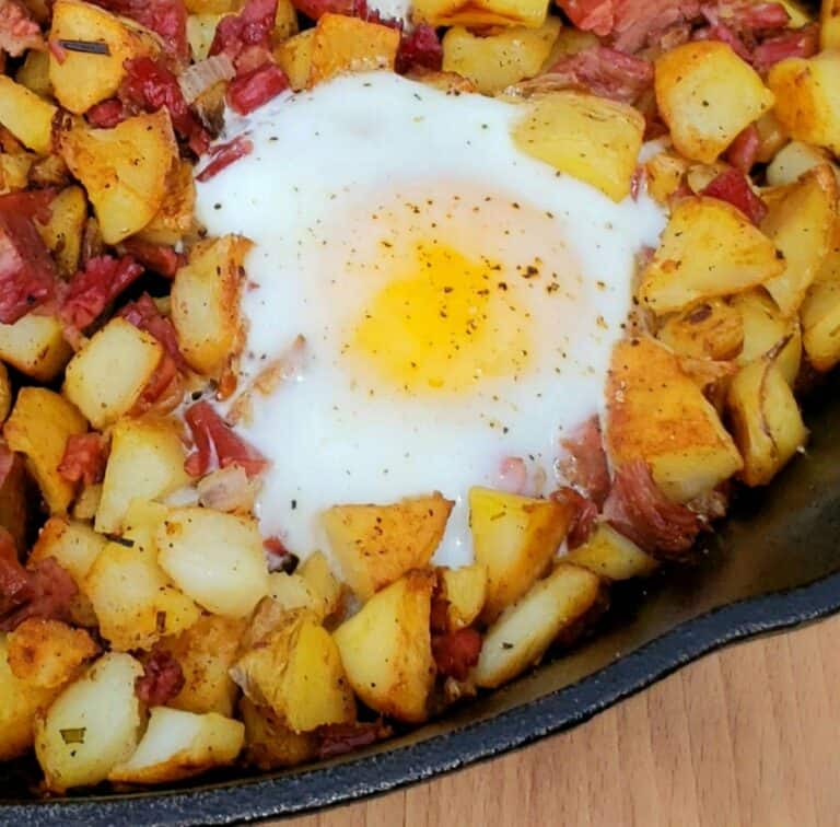 Corned Beef Hash with Shirred Eggs Grits and Gouda