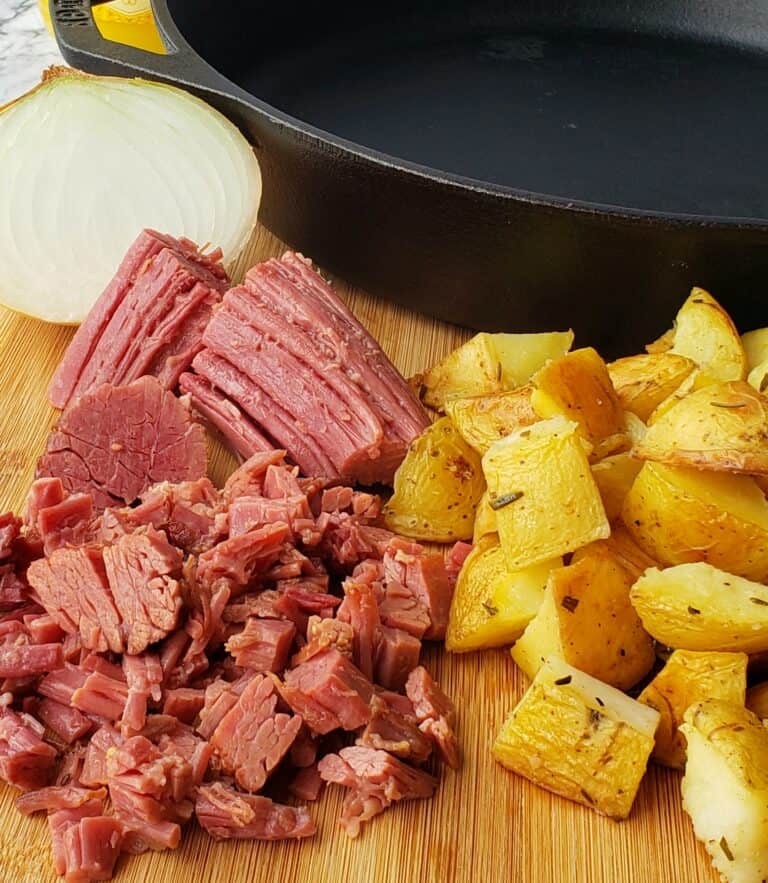 Corned Beef Hash with Shirred Eggs Grits and Gouda