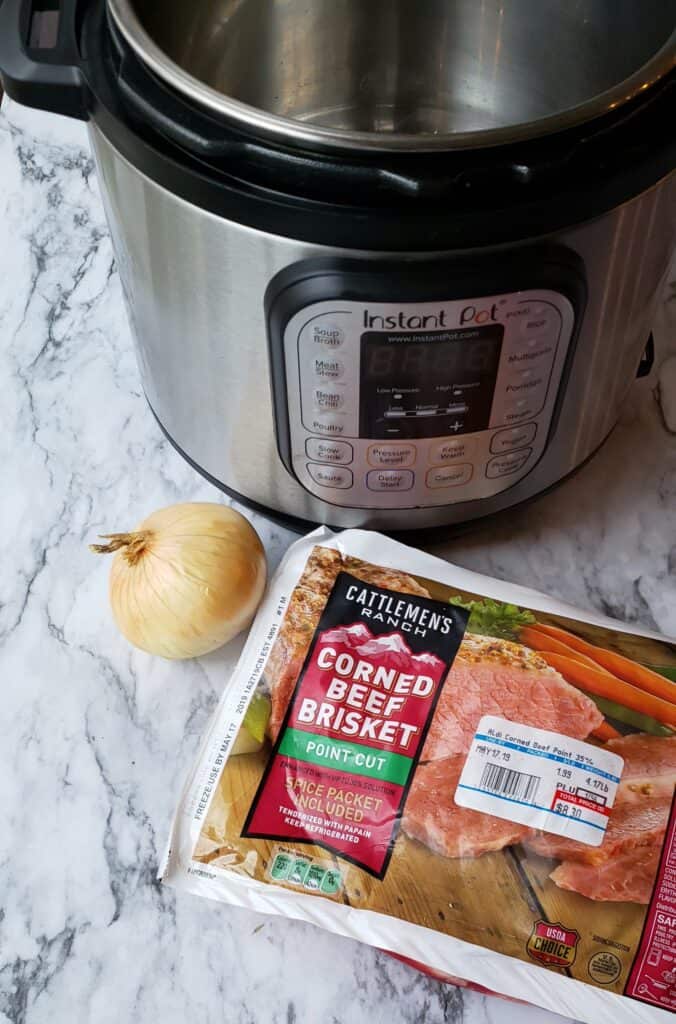 Instant Pot Corned Beef is an easy 3 ingredient recipe and one of those ingredients is water! Instant Pot unopened package of corned beef and one onion