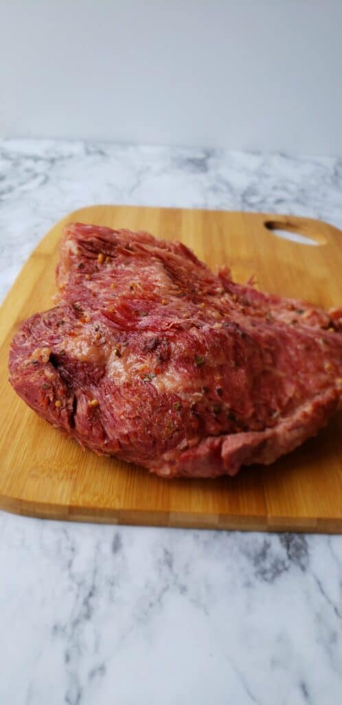 After draining, let the corned beef cool slightly on a cutting board