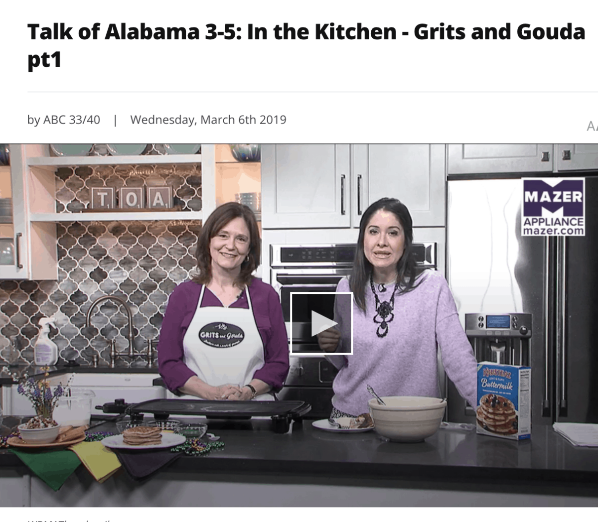 Two women behind a kitchen counter and pancake griddle