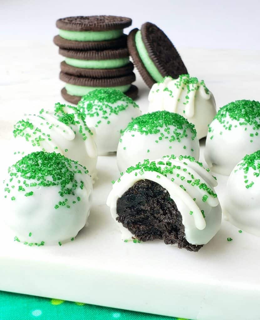 Coated in white chocolate and topped with green sprinkles, these bite-size Oreo cookie balls are easy to make and perfect for St. Patricks Day or Christmas. 