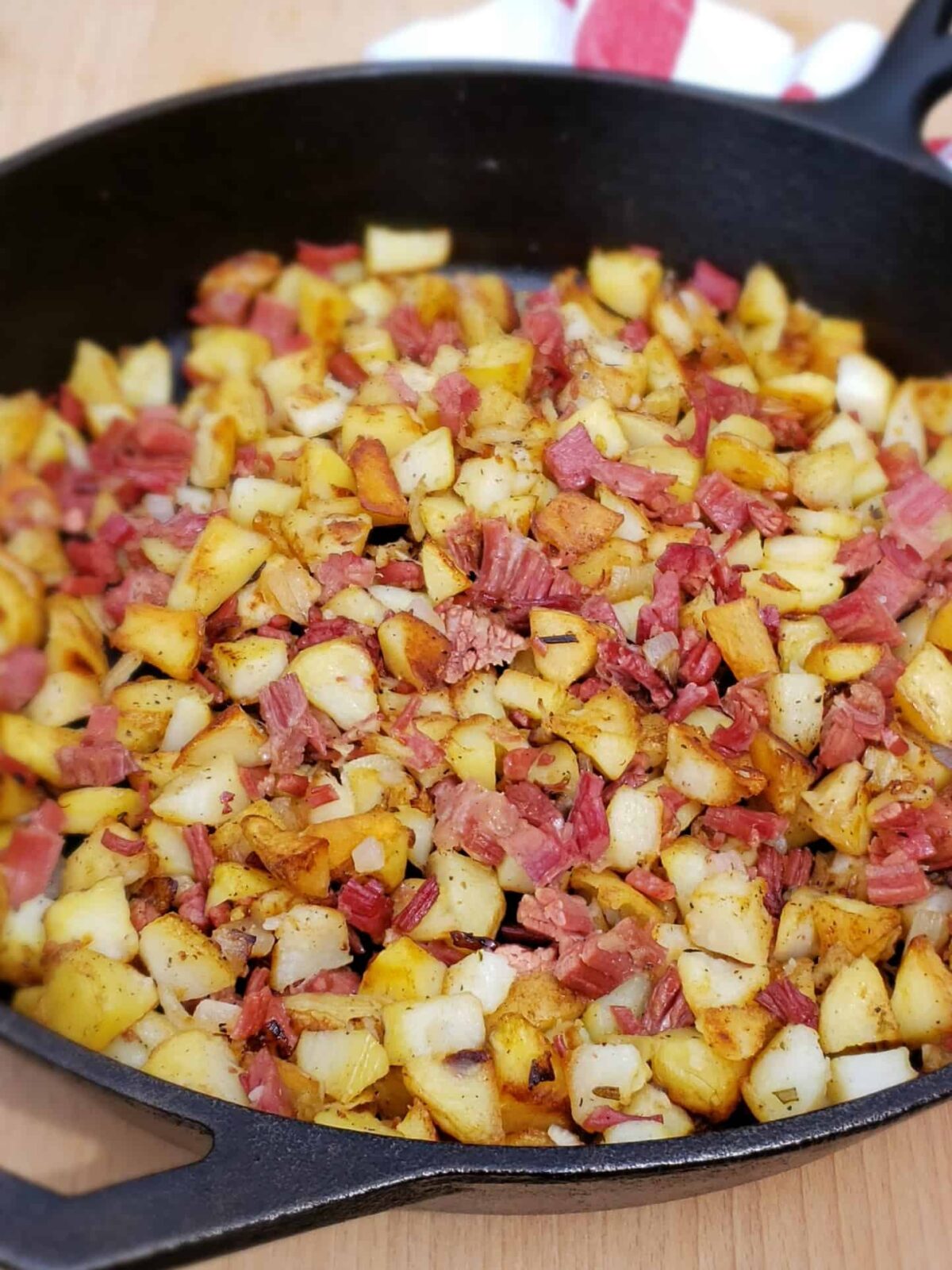 Corned Beef Hash with Shirred Eggs Grits and Gouda