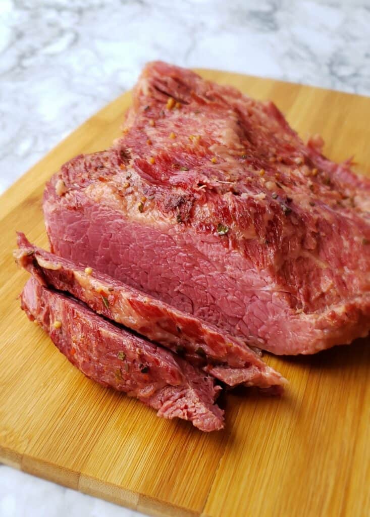 Slice the corned beef brisket diagonally against the grain. Otherwise, you will have long strings of meat.