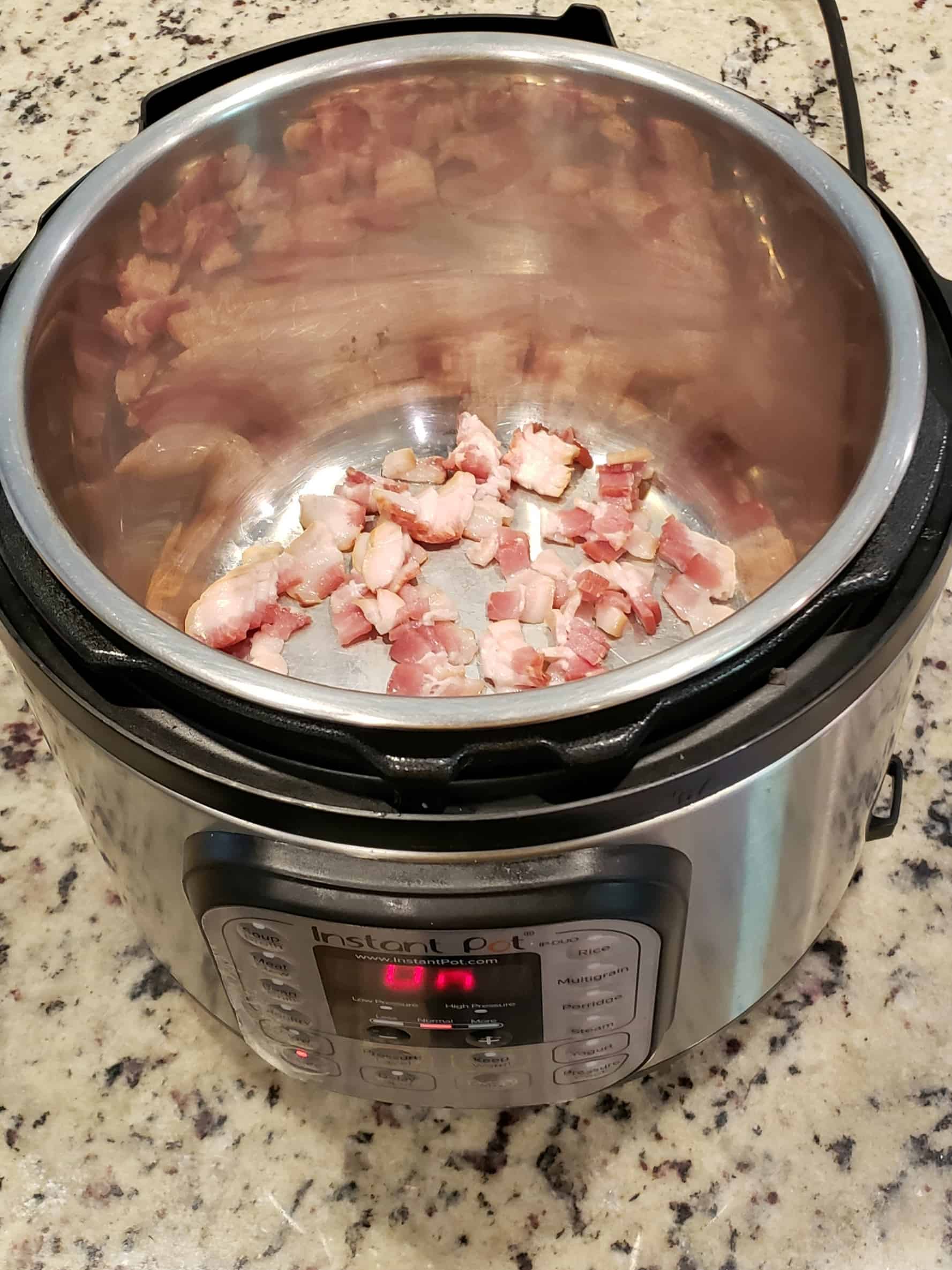 Cooking pieces of bacon in the Instant Pot on Saute