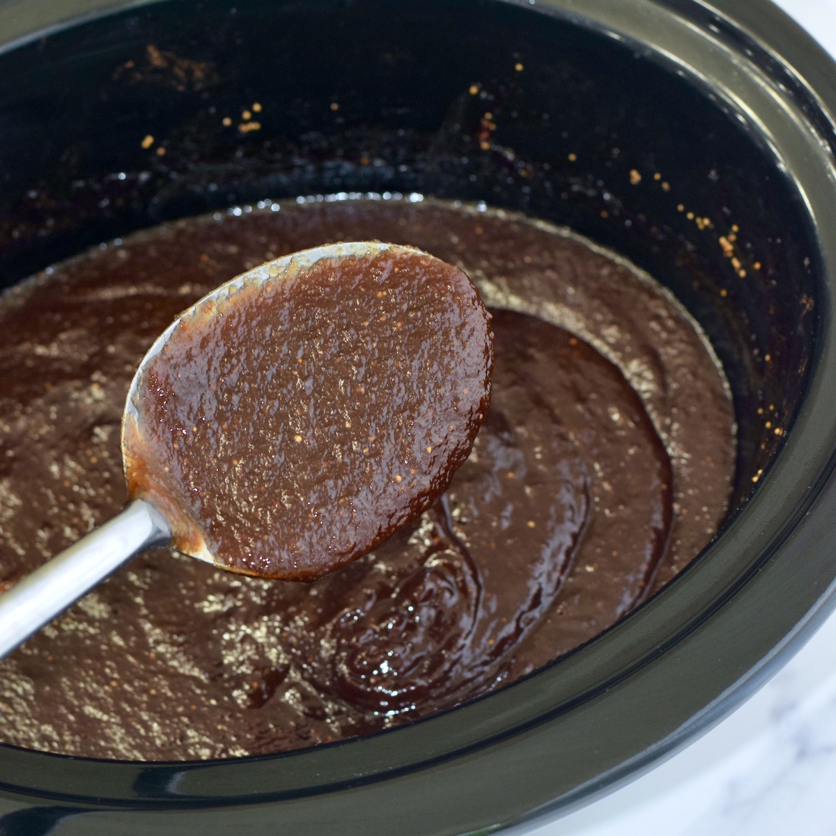 Fig jam in crockpot.