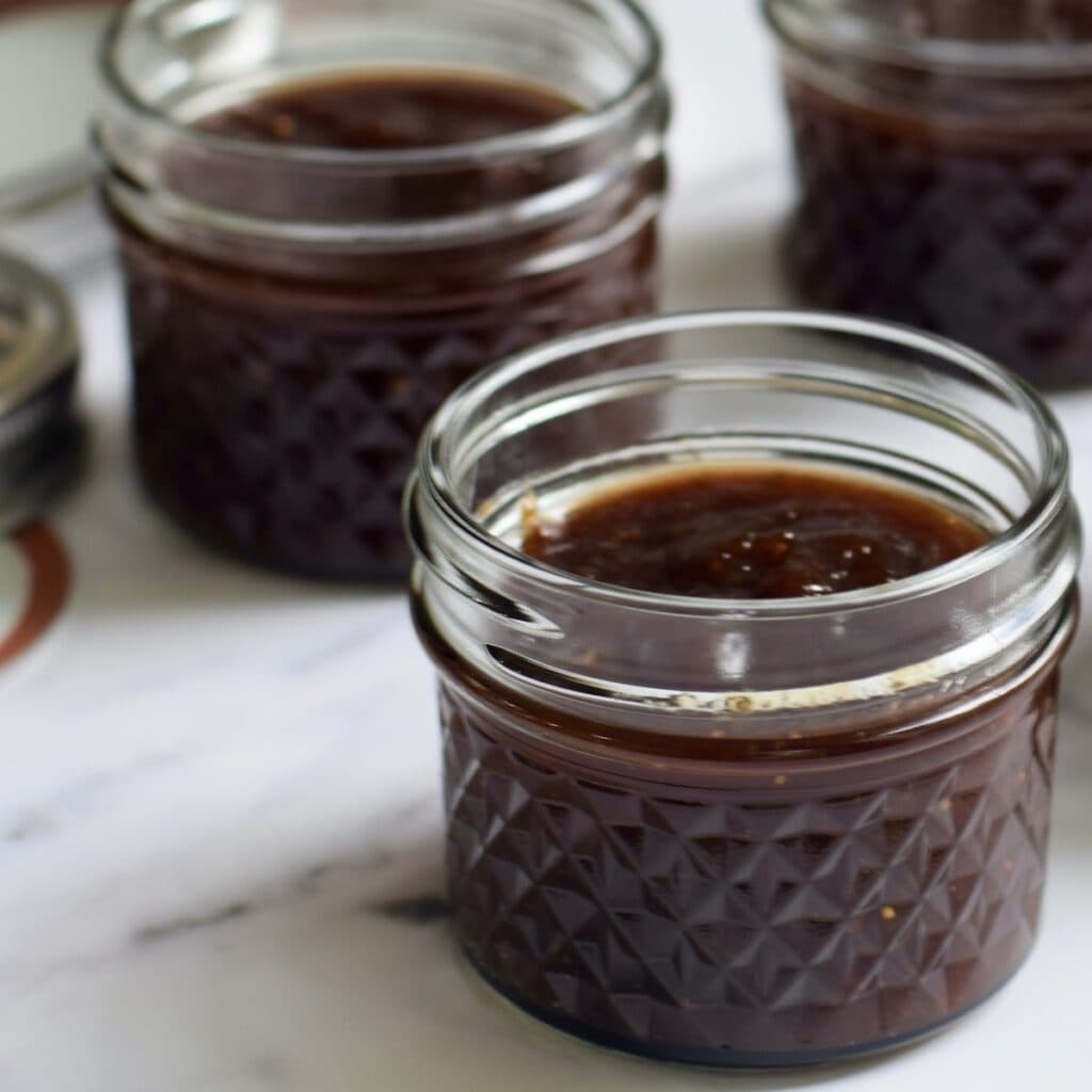 Opened jars of fig jam.