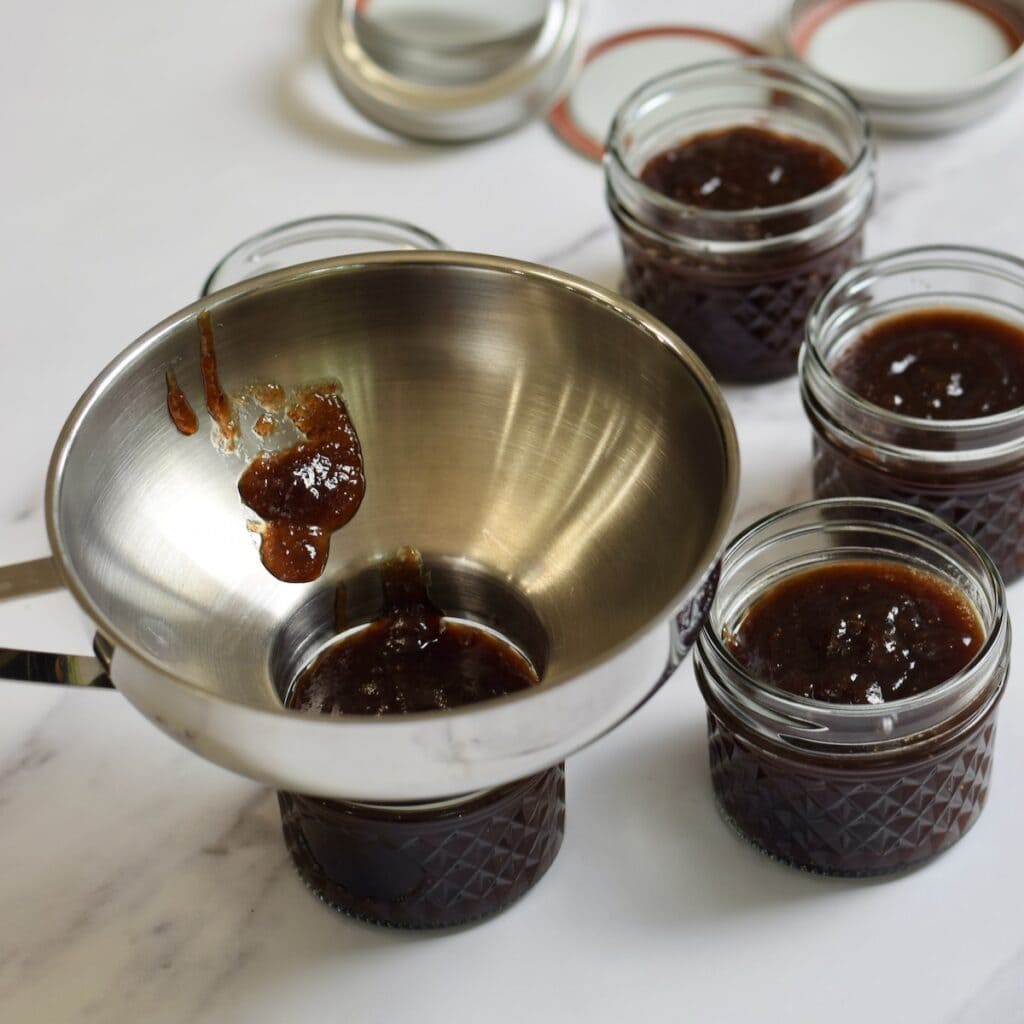 Canning funnel on a jar of fig jam.