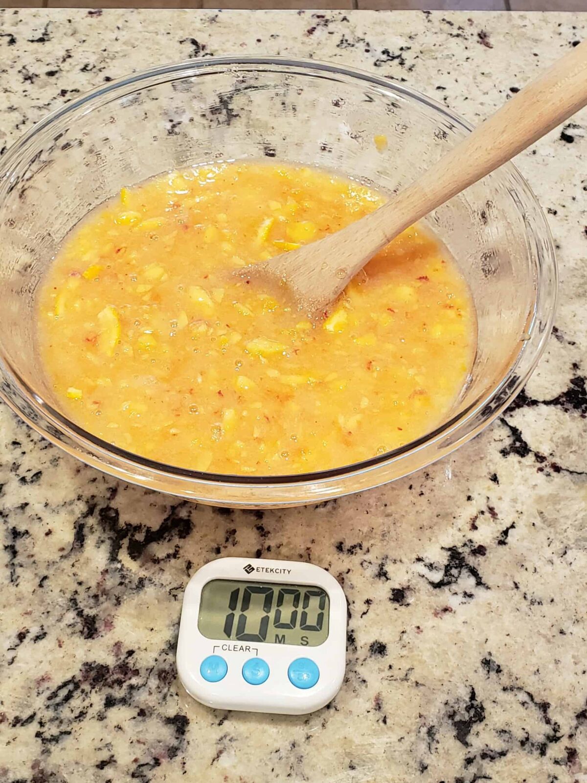 3 cups of chopped peaches, orange slices and 4 1/2 cups sugar in a large bowl.