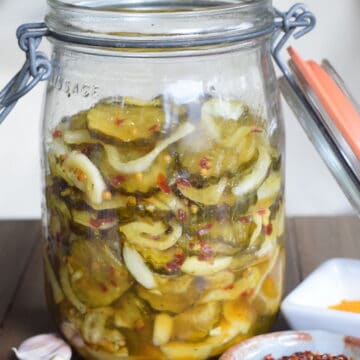 pickles and onions in old mason jar