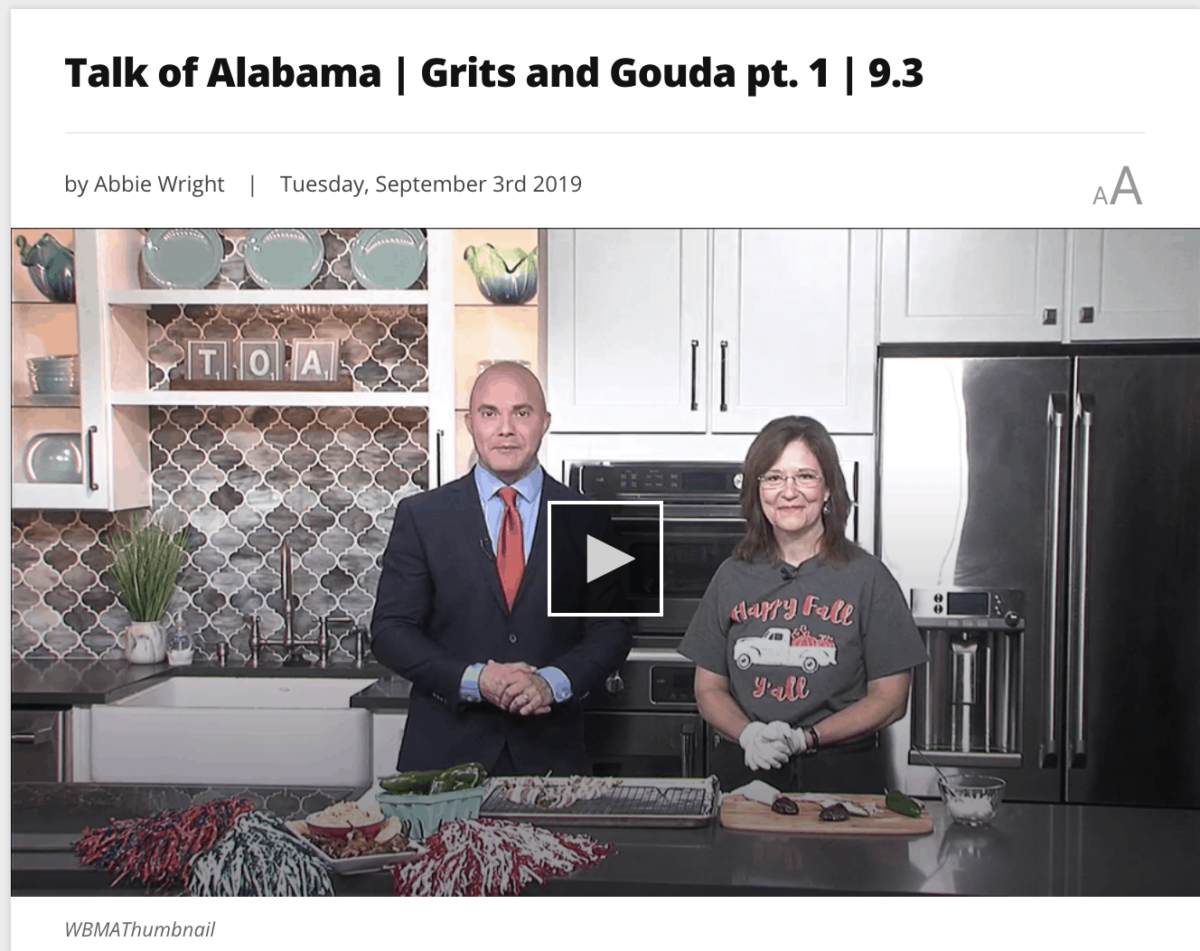 Video clip picture of man in suit and woman in t shirt on tv kitchen set