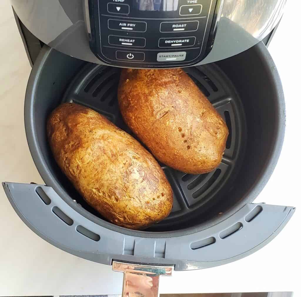 Air Fryer Baked Potatoes with BBQ Pulled Pork Grits and Gouda