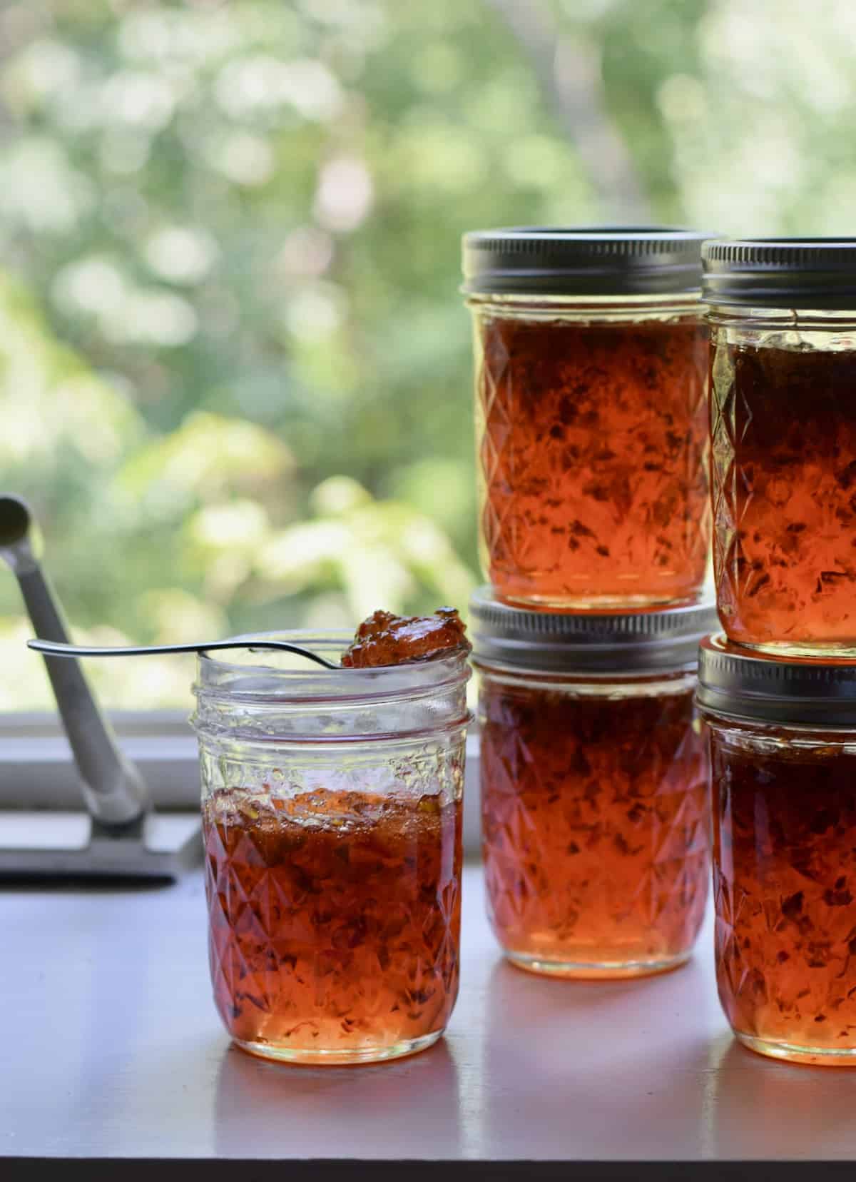 Jalapeno Pepper Jelly jars in window.