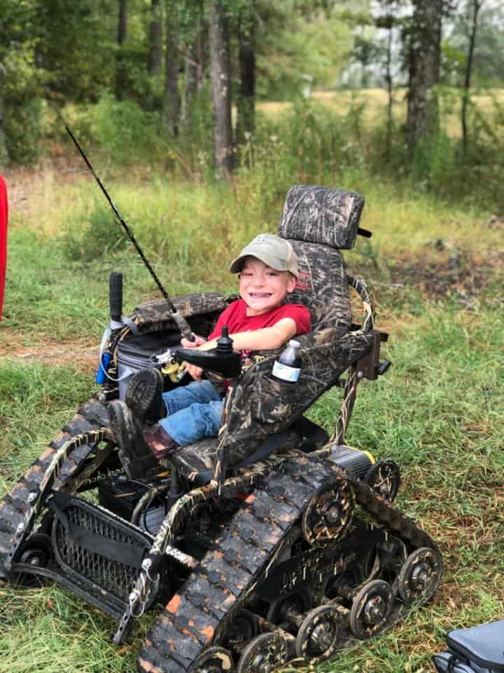 boy in tank-like wheelchair