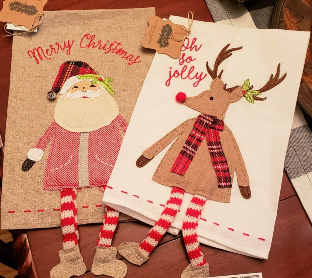 two kitchen towels wtih santa and a reindeer